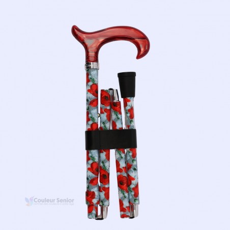 Poignée Derby rouge confortable sur canne de marche pour femme, pliée, avec fleurs de coquelicot.