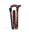 Canne de marche pliable pour femme, motif fruits rouges sur fond noir, pliée à gauche.