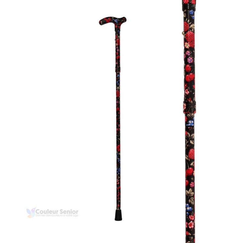 Vue entière de la canne de marche originale pour femme, noire avec motif de fruits rouges.