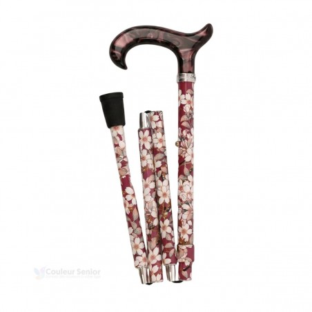 Canne de marche pliée vieux rose, discrète et élégante pour femme en aluminium léger.