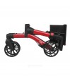 Rollator Brooklyn Quun rouge, en position pliée, avec un rangement ultra-pratique pour les petits espaces.