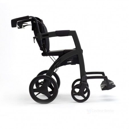 Rollz Motion noir mat en mode fauteuil de transfert, vue de côté avec grandes roues pneus pleins et repose-pieds déployés