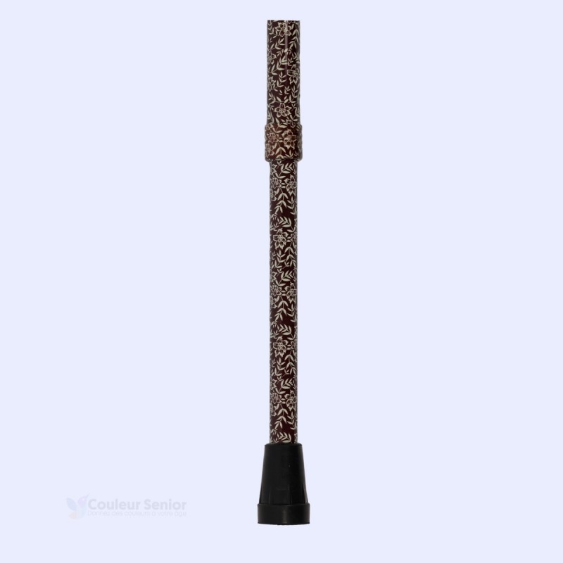 Détail de l'embout de cette canne de marche à motif de petites fleurs marron pour femme. Base discrète en aluminium élégant.