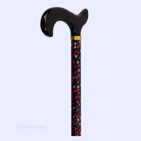 Canne florale rose réglable pour femme senior, vue à 45°. C'est un cadeau idéal à offrir.