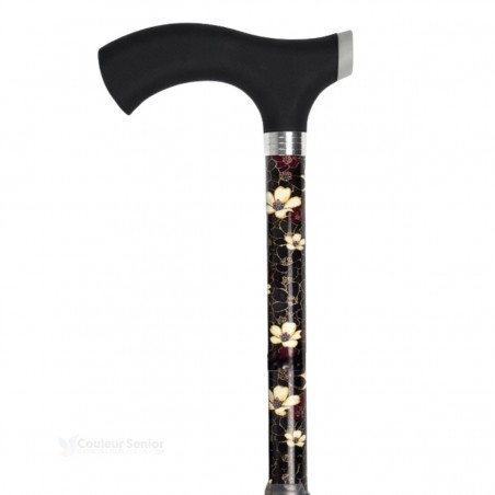 Canne de marche noire avec des fleurs blanches et une poignée douce au toucher. Éligible au remboursement par la Sécu.
