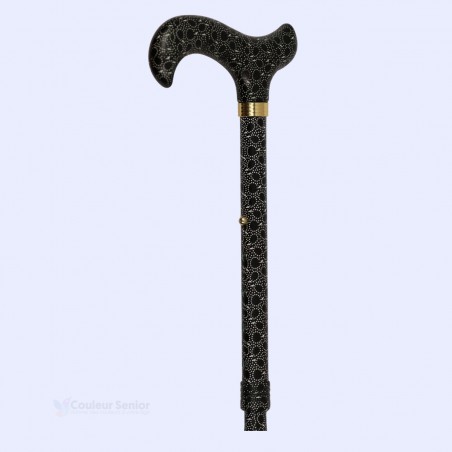 Canne senior pliable noire à petits motifs, vue à 45°. Accessoire original pour femme.
