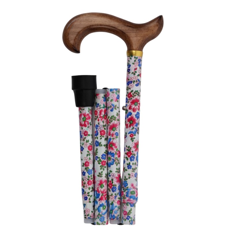 Canne de marche pliable, motif floral sur fond blanc, et poignée en bois clair. Éligible au remboursement par la Sécu.