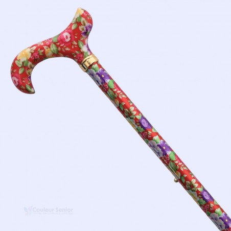 Vue diagonale de la canne de marche fantaisie rouge, réglable pour femme, motif floral.