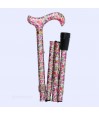 Canne fleuri pliable côté droit, accessoire pratique combinant mobilité et esthétique.