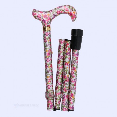Canne fleuri pliable côté droit, accessoire pratique combinant mobilité et esthétique.