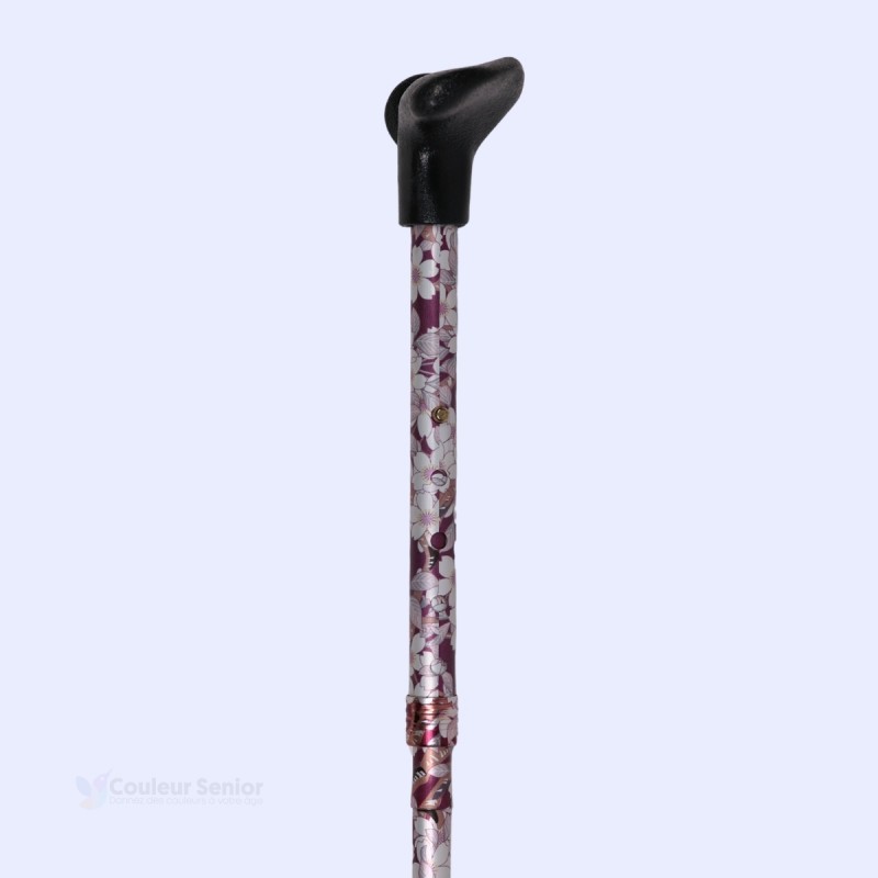 Belle canne pliante originale. Motif floral, fond prune et poignée pratique pour gaucher.
