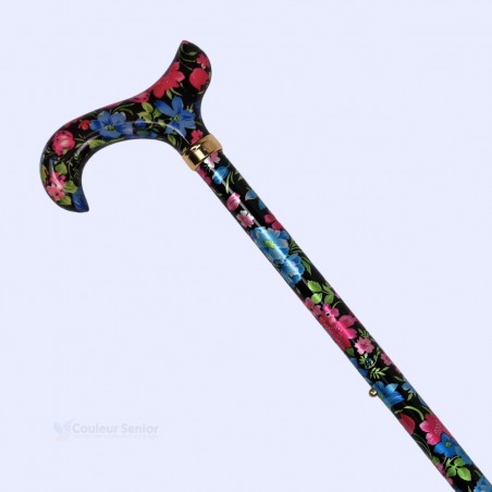Détail du motif à fleurs de cerisier aux couleurs brillantes sur la canne de marche pour femme.