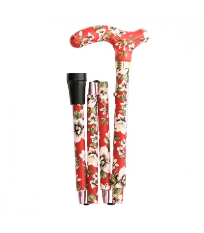 Superbe canne pliante originale motif fleurs blanches sur fond rouge. Une marche très sûre.