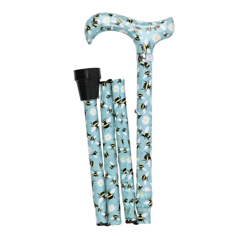 Superbe canne pliante motif abeilles sur fond aqua. Une marche très sûre et confortable.