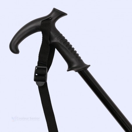 Gros plan sur la poignée en T ergonomique noire et la dragonne de sécurité du bâton de marche en aluminium réglable