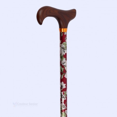 Poignée Derby en bois de luxe sur une canne de marche féminine en aluminium à motif floral de qualité pharmacie.