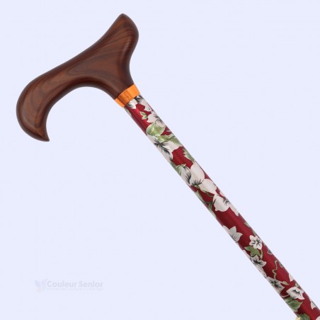 Détail floral d'une élégante canne de marche de luxe en aluminium avec poignée Derby en bois. Éligible au remboursement.