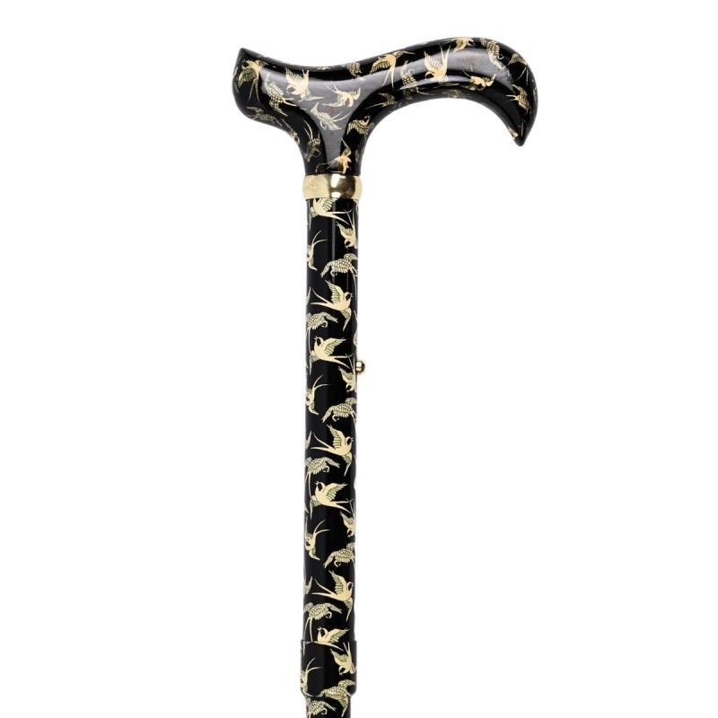 Détail élégant d'hirondelles sur la canne de marche Derby. Design noir classique pour une femme chic.