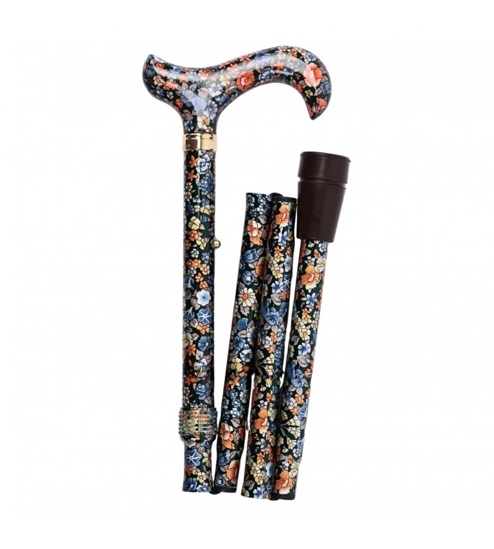 Canne de marche pliable CouleurSenior décorée de fleurs, vue du côté gauche, montrant sa compacité pour le rangement.
