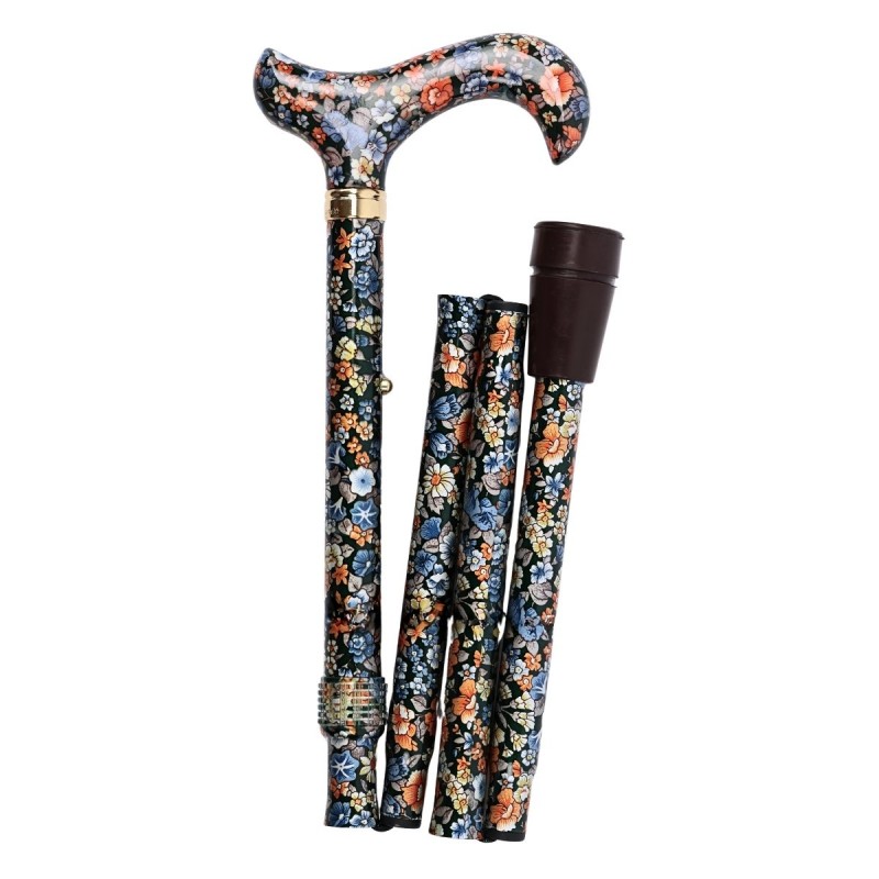 Canne de marche pliable CouleurSenior décorée de fleurs, vue du côté gauche, montrant sa compacité pour le rangement.