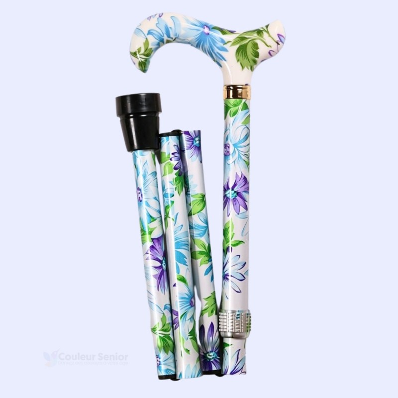 Canne de marche pliable, compacte et réglable, fleuris colorée sur un blanc perle.