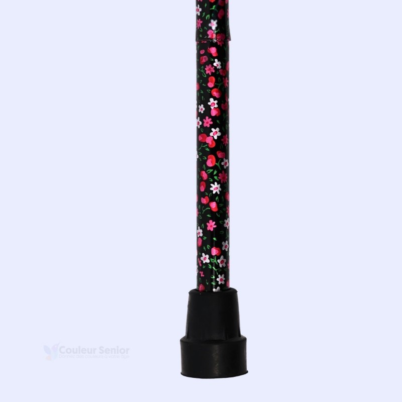Embout sécurisé de la canne de marche florale noire, indispensable à la stabilité des seniors.