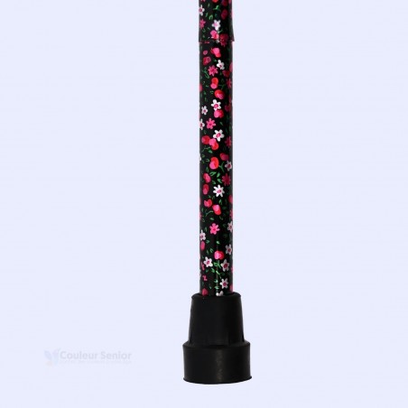 Embout sécurisé de la canne de marche florale noire, indispensable à la stabilité des seniors.